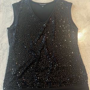 Black sequin V-neck holiday top.